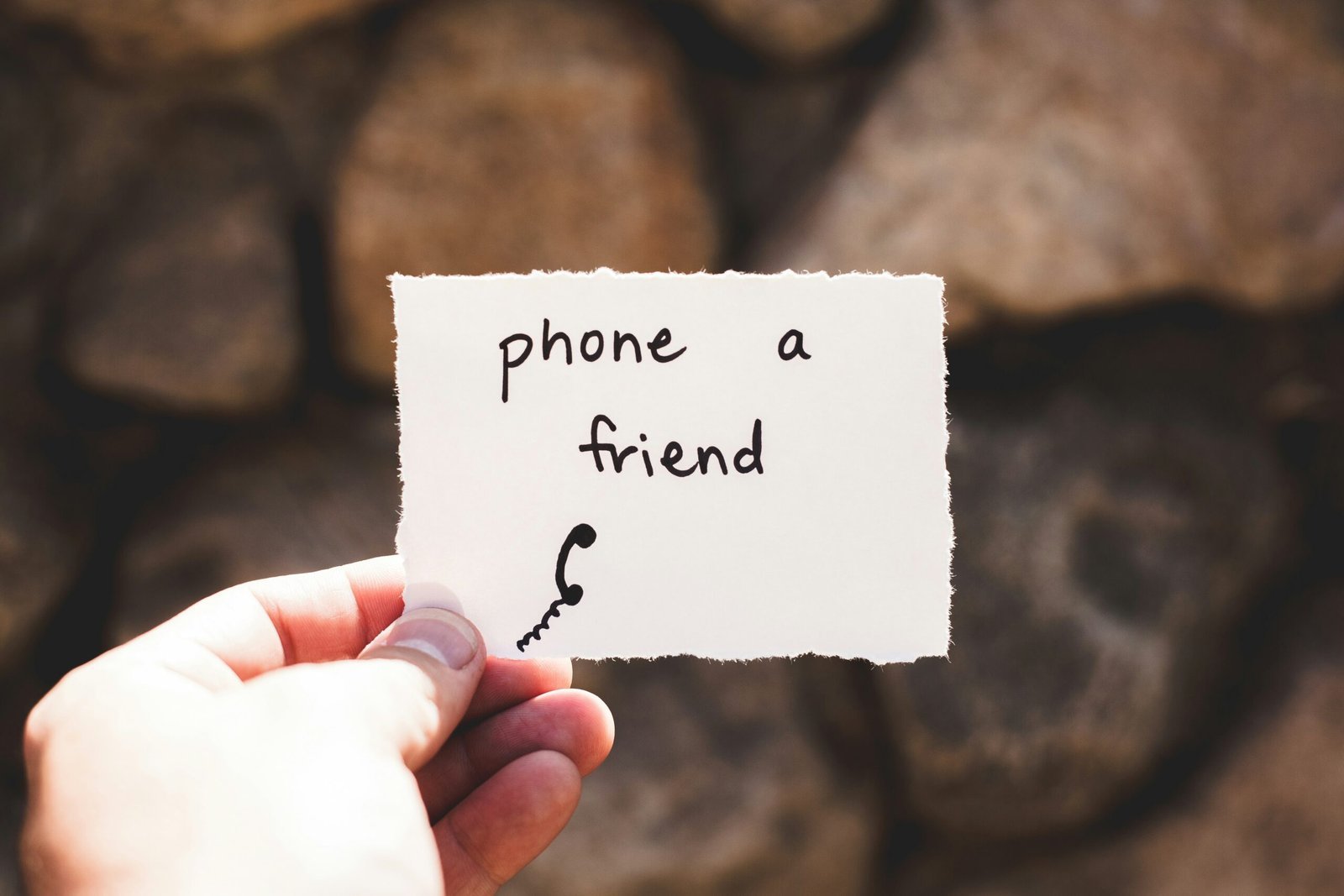 A note that says phone a friend, used as a symbol of support beyond conventional therapy